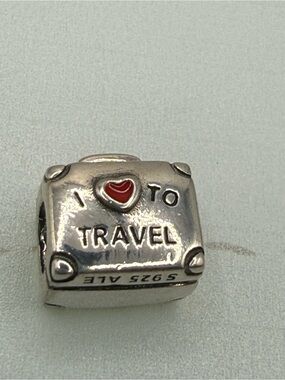 Pandora “Love to Travel Charm